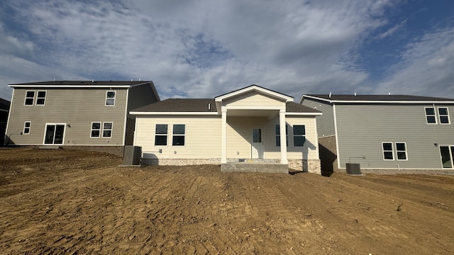 back of house featuring central AC unit