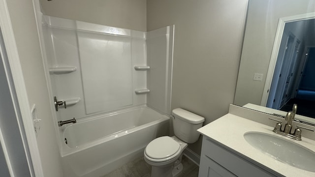 full bathroom featuring vanity, bathing tub / shower combination, and toilet