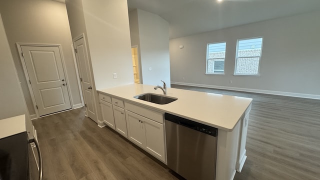 kitchen with white cabinetry, dark hardwood / wood-style flooring, stainless steel dishwasher, and sink