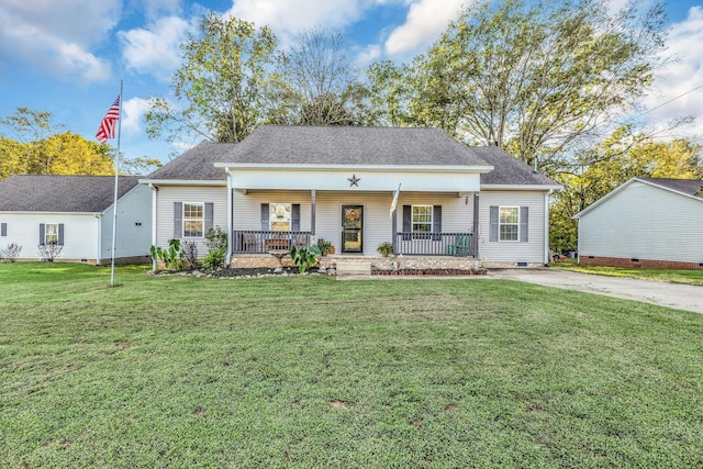 view of front facade with a front yard and covered porch