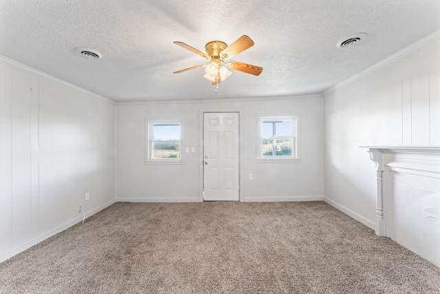 unfurnished living room with ornamental molding, a healthy amount of sunlight, visible vents, and ceiling fan