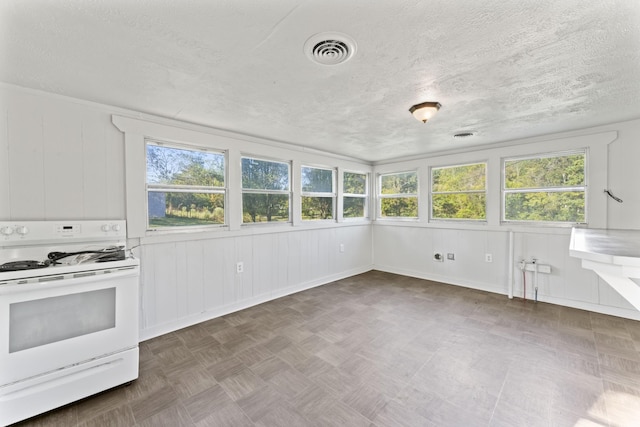 unfurnished sunroom with visible vents and a textured ceiling