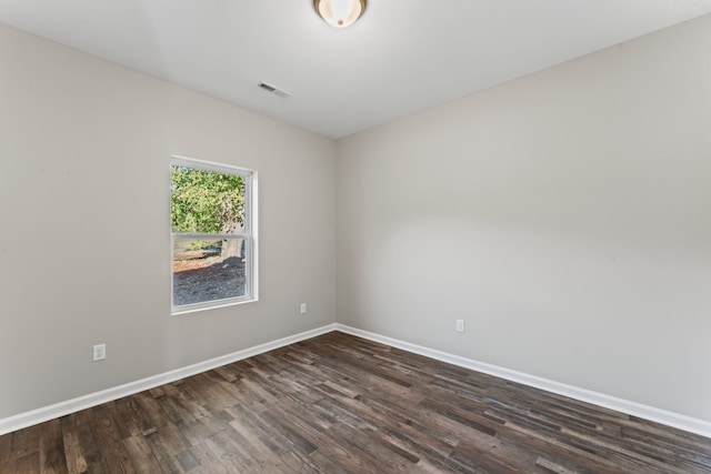 unfurnished room featuring dark hardwood / wood-style floors