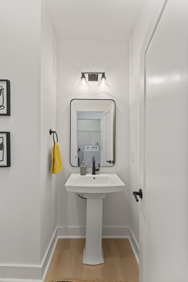 bathroom with hardwood / wood-style flooring