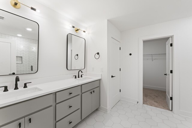 bathroom with tile patterned floors and vanity