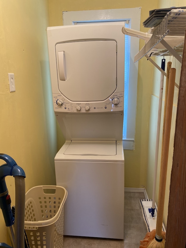 washroom with stacked washer / dryer