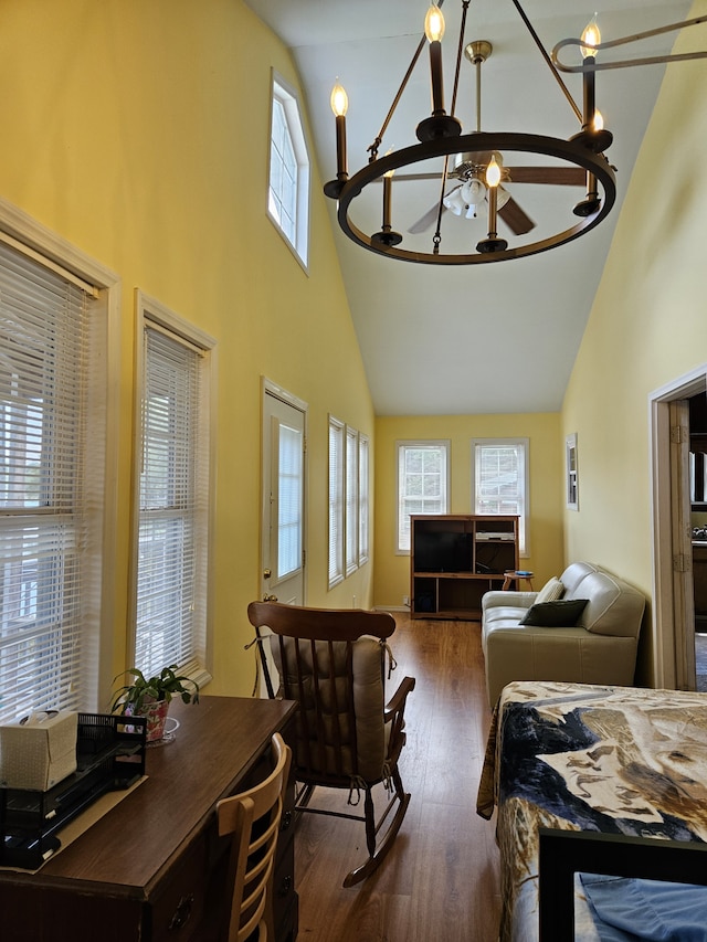 bedroom with an inviting chandelier, dark hardwood / wood-style flooring, multiple windows, and high vaulted ceiling