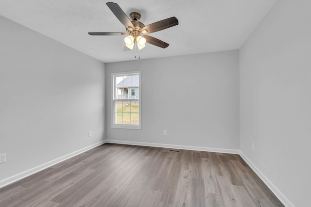 unfurnished room with light hardwood / wood-style floors and ceiling fan