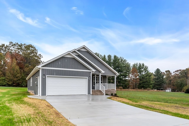 craftsman house with a garage, a porch, and a front lawn