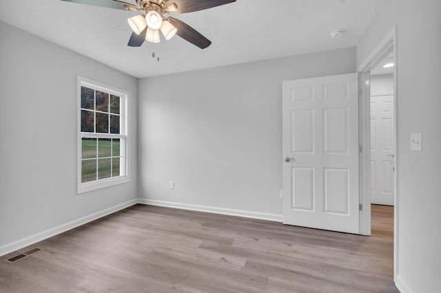 unfurnished room with light hardwood / wood-style floors and ceiling fan