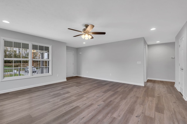 unfurnished room featuring light wood-type flooring and ceiling fan