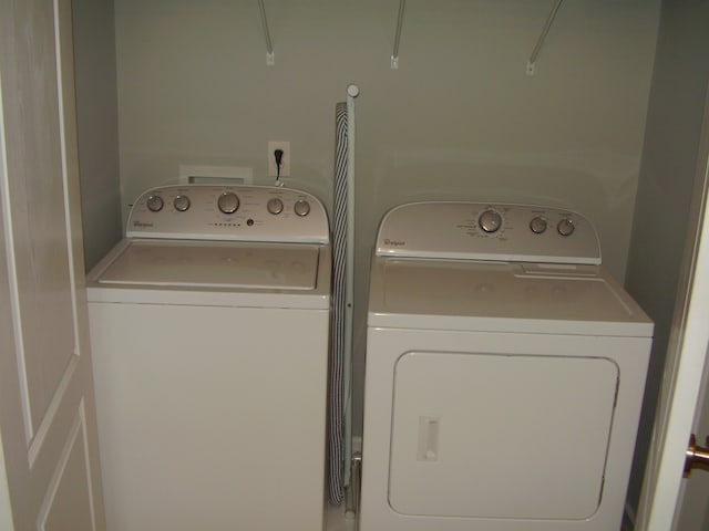 clothes washing area with independent washer and dryer