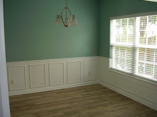 unfurnished room with dark hardwood / wood-style floors