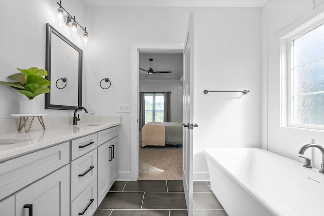 bathroom with vanity, ceiling fan, tile patterned floors, and a relaxing tiled tub