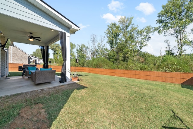 view of yard with a patio, outdoor lounge area, and ceiling fan