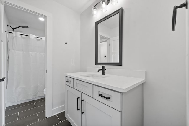 bathroom with tile patterned flooring, vanity, toilet, and a shower with curtain