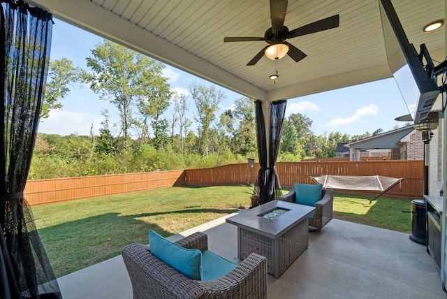 view of patio / terrace with ceiling fan and an outdoor living space