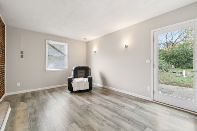 unfurnished room with light wood-type flooring