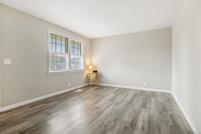 empty room featuring wood-type flooring