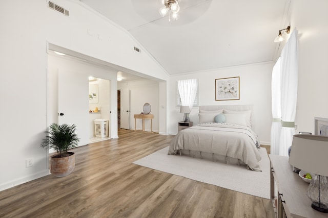 bedroom with crown molding, hardwood / wood-style flooring, high vaulted ceiling, and ceiling fan