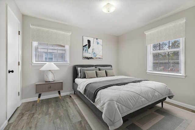 bedroom with light hardwood / wood-style flooring