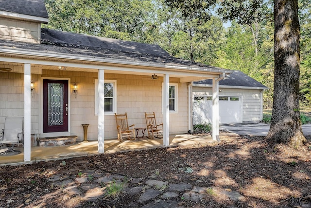 view of front facade with a porch and a garage