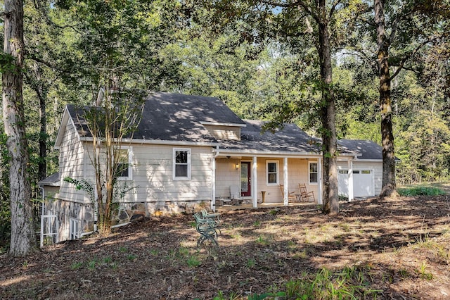 view of front facade featuring a garage and covered porch