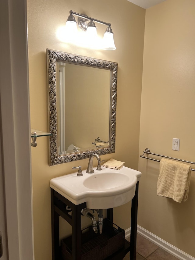 bathroom with tile patterned flooring and baseboards