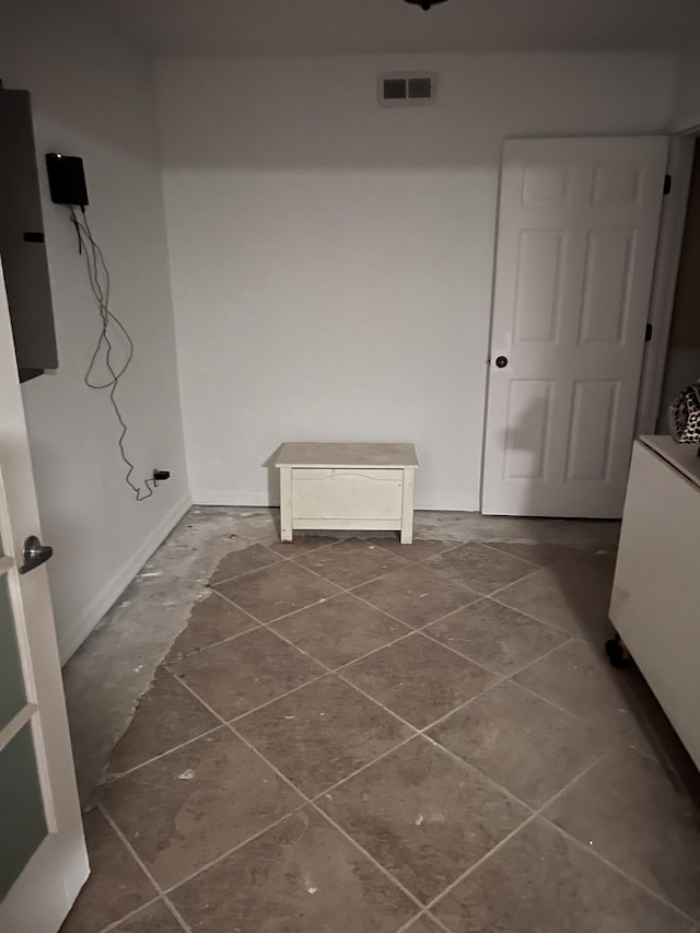 laundry room with tile patterned flooring and visible vents