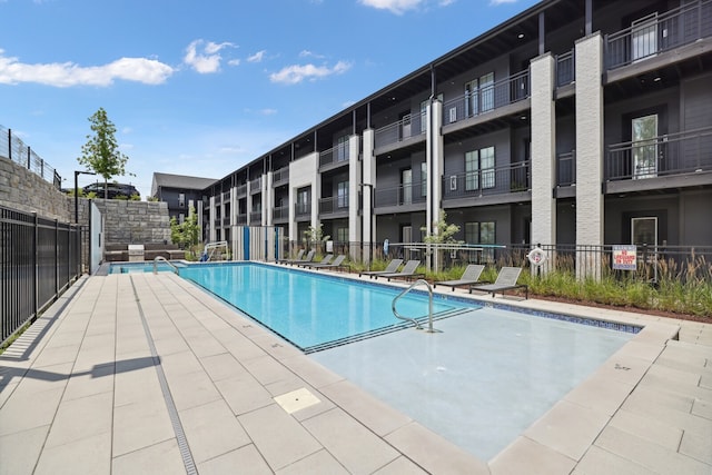 view of swimming pool featuring a patio