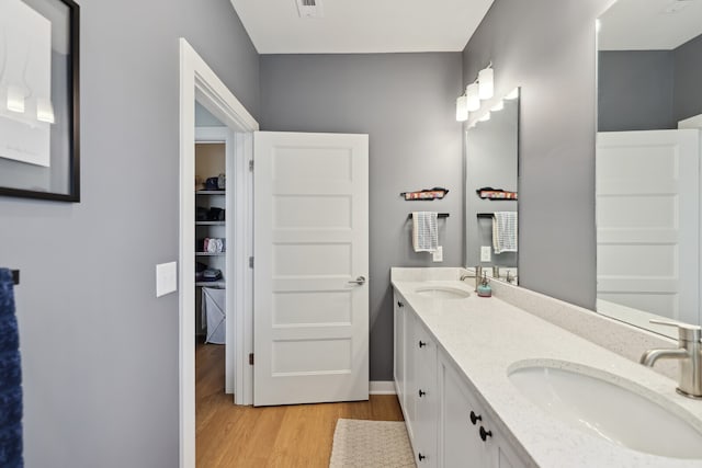 bathroom with vanity and hardwood / wood-style floors