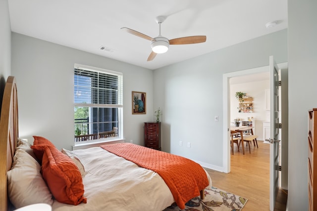 bedroom featuring light hardwood / wood-style floors and ceiling fan