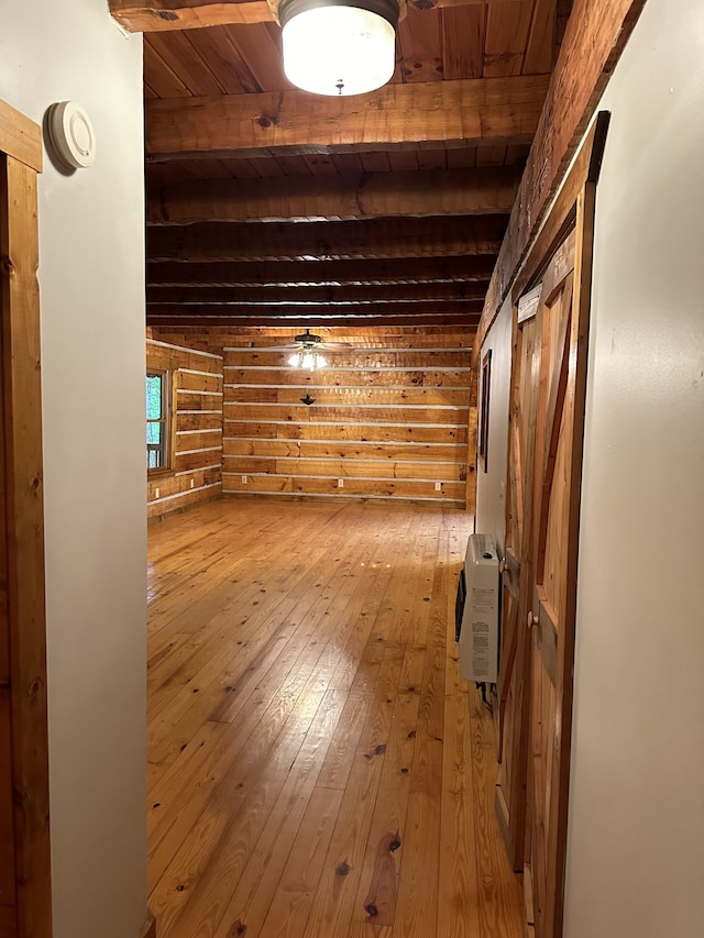 bonus room featuring wood ceiling, heating unit, beam ceiling, and light wood-type flooring