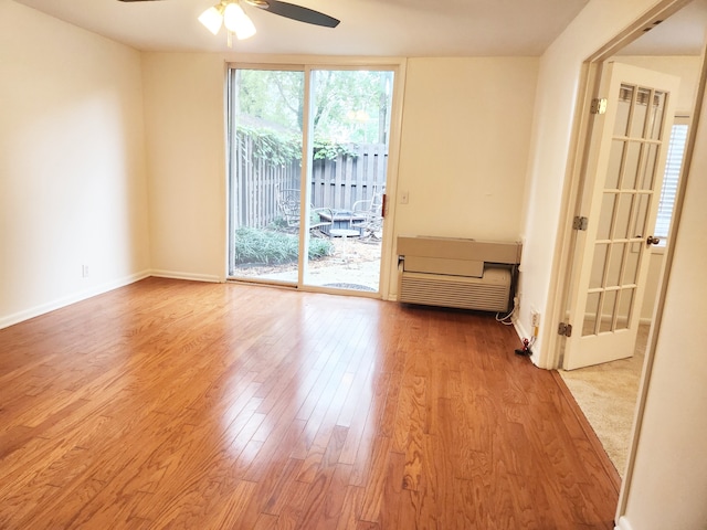 unfurnished room featuring ceiling fan and light hardwood / wood-style floors