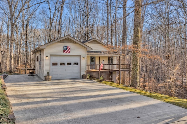 view of front of house featuring a garage and a porch