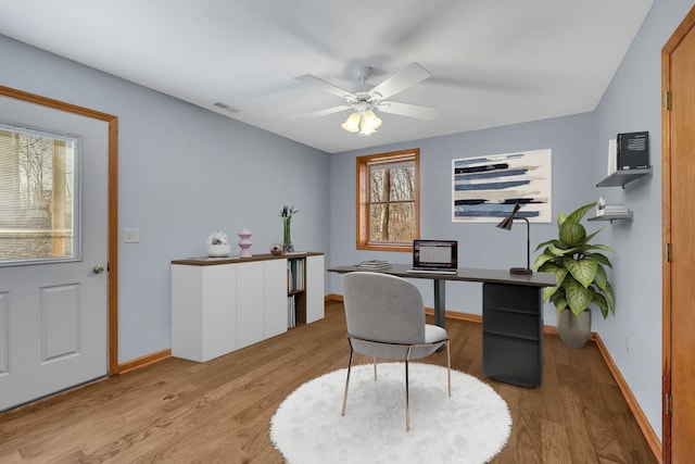 office space featuring light hardwood / wood-style floors and ceiling fan