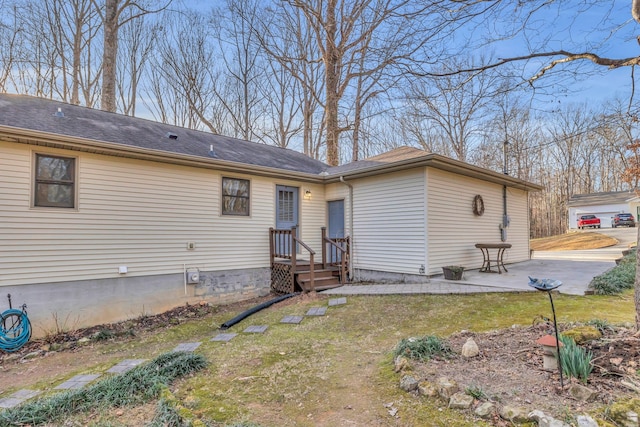 rear view of house with a yard