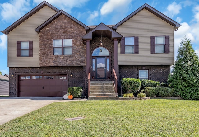 view of front of property featuring a garage and a front lawn