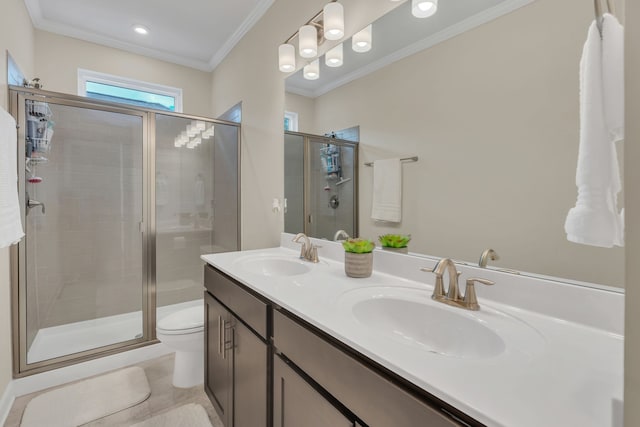 bathroom with ornamental molding, a shower with shower door, vanity, and toilet