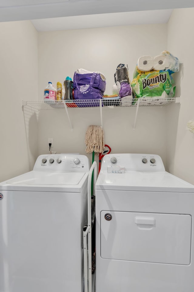 laundry area with independent washer and dryer