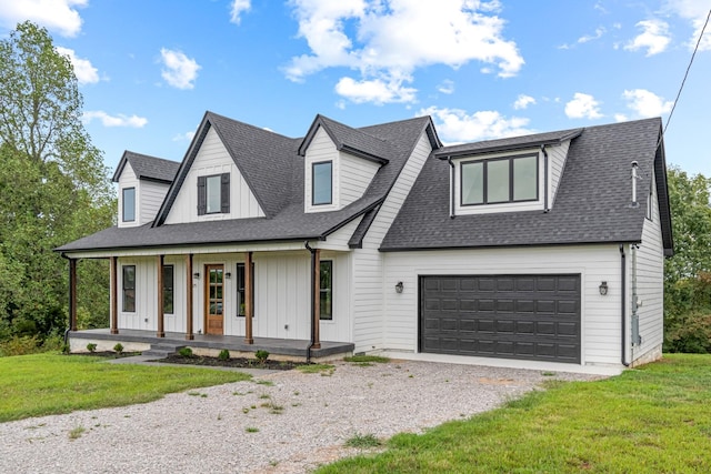 modern farmhouse style home with a front yard, covered porch, board and batten siding, roof with shingles, and gravel driveway