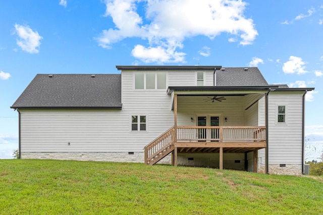 rear view of property featuring a wooden deck, crawl space, a shingled roof, a lawn, and a ceiling fan