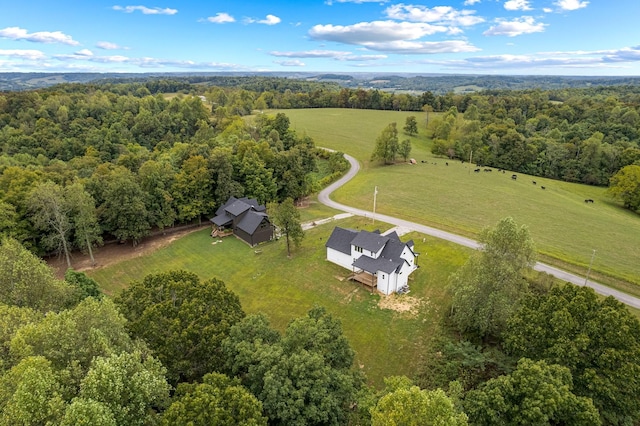 drone / aerial view with a rural view and a view of trees