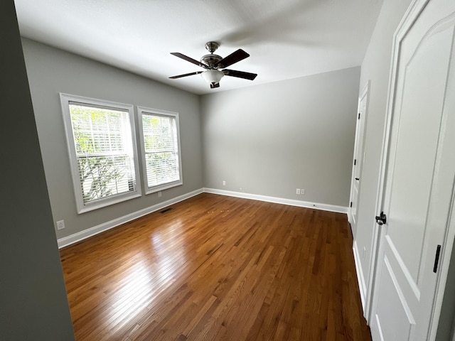 4615 Sango Rd, Clarksville, TN 37043 - unfurnished room with dark wood finished floors, baseboards, and a ceiling fan