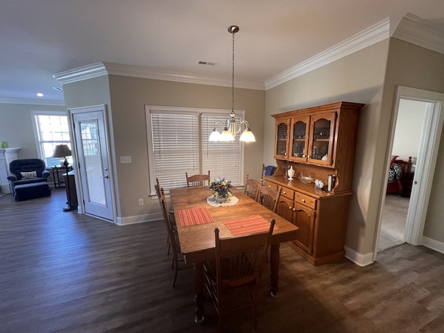 dining area featuring a notable chandelier, crown molding, and dark wood-type flooring