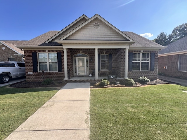 view of front of home with a front lawn and a porch