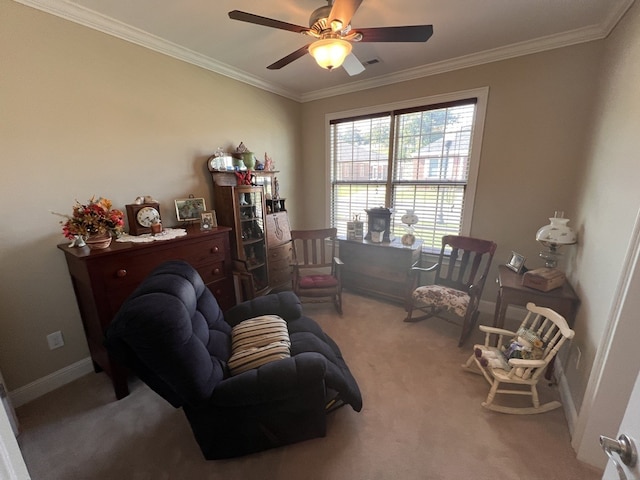 carpeted living room with ornamental molding and ceiling fan