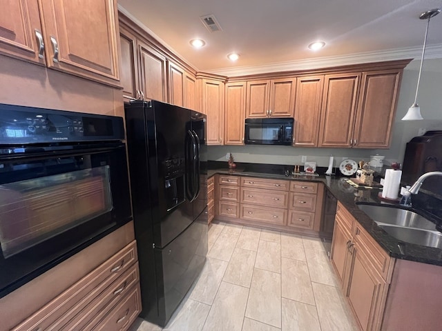 kitchen featuring pendant lighting, sink, black appliances, ornamental molding, and dark stone countertops