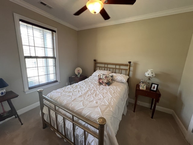 bedroom with carpet, ornamental molding, and ceiling fan