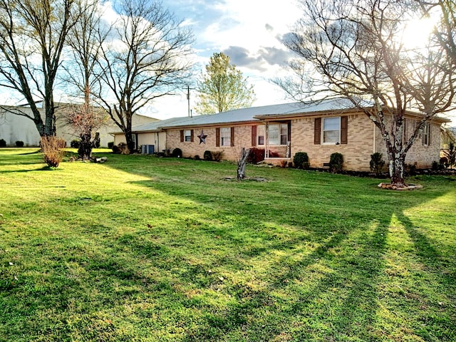 single story home with a front yard and central air condition unit